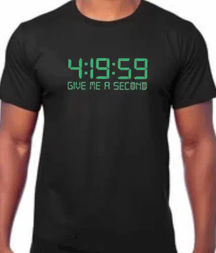 Image of a black cannabis weed t-shirt with the phrase '4:20 Cannabis Culture T-shirt' prominently displayed. The slogan '4:19:59 give me a second' is featured below the main text. The design evokes the essence of cannabis culture and its associated time reference.